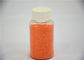Πορτοκαλιά ζωηρόχρωμα στίγματα βάσεων θειικού άλατος νατρίου στιγμάτων στην καθαριστική σκόνη